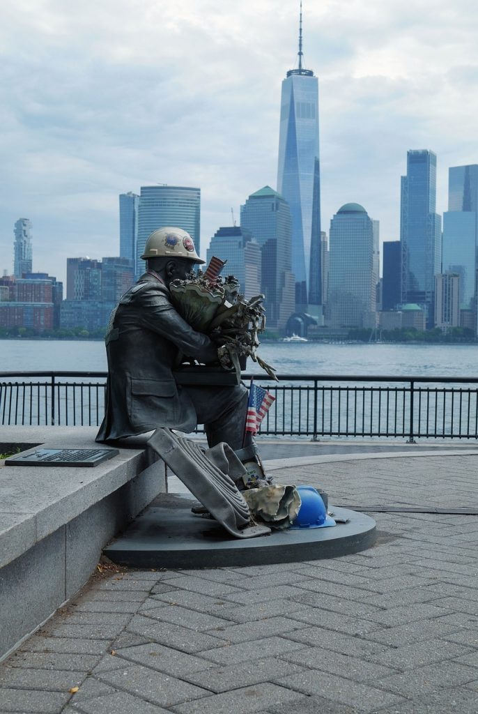 9/11 Statue with the One World Trade Center in the background
